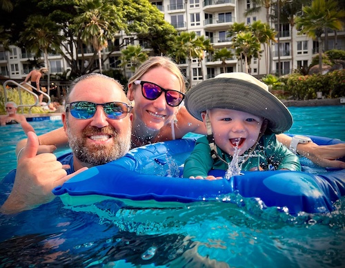 Alex, Emmy & baby Eli taking a resort pool swim